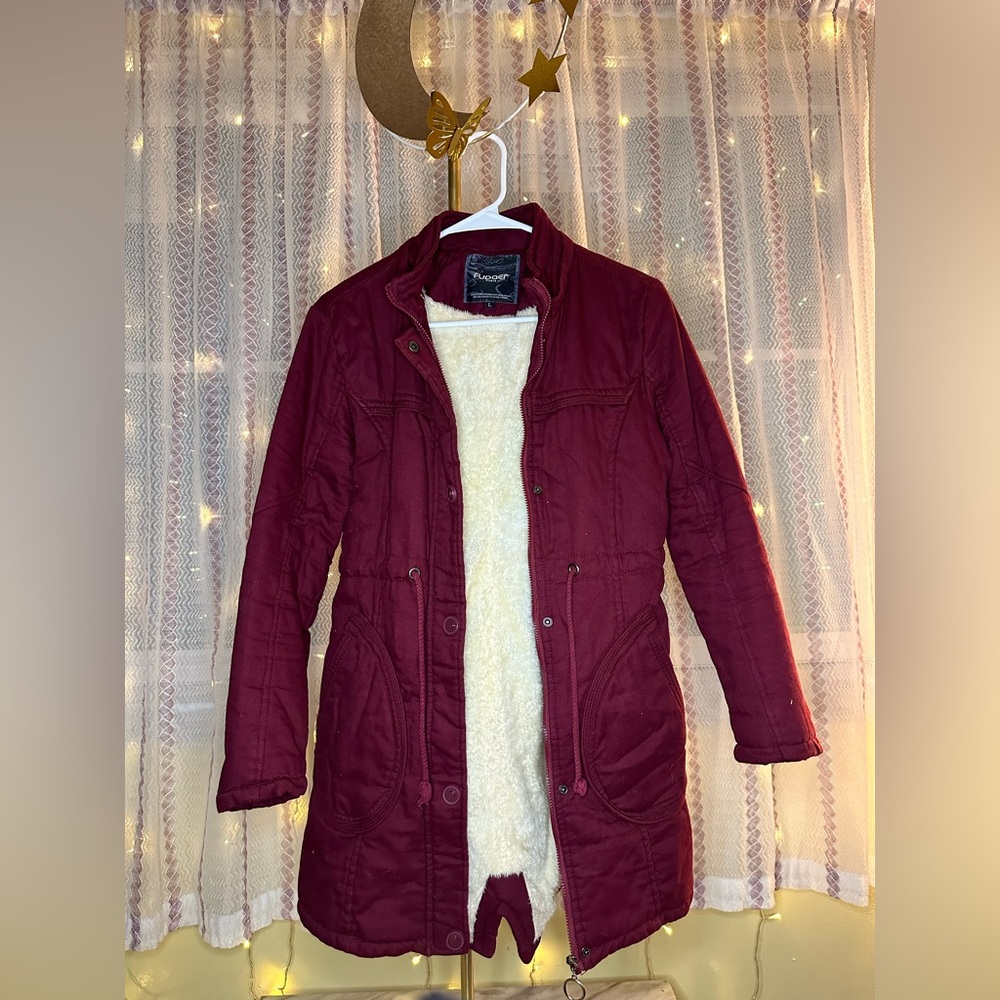 Stay cozy and dry in style with this red super warm Raincoat!